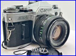 Canon AE-1 35 mm Camera 50mm f1.8 FD Lens & vintage strap FILM Tested Canon AE-1 35 mm Camera 50mm f1.8 FD Lens & vintage strap FILM Tested
