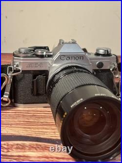 Canon AE-1 35mm SLR Film Camera with 35-135mm f/3.5-4.5 Lens Vintage TESTED WORKS Canon AE-1 35mm SLR Film Camera with 35-135mm f/3.5-4.5 Lens Vintage TESTED WORKS