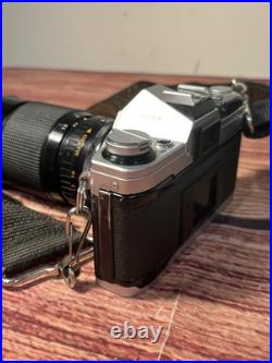 Canon AE-1 35mm SLR Film Camera with 35-135mm f/3.5-4.5 Lens Vintage TESTED WORKS Canon AE-1 35mm SLR Film Camera with 35-135mm f/3.5-4.5 Lens Vintage TESTED WORKS