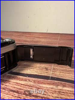 Canon AE-1 35mm SLR Film Camera with 35-135mm f/3.5-4.5 Lens Vintage TESTED WORKS Canon AE-1 35mm SLR Film Camera with 35-135mm f/3.5-4.5 Lens Vintage TESTED WORKS