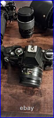 Canon AE-1 Black Vintage SLR Camera with Multiple Lenses and Cases