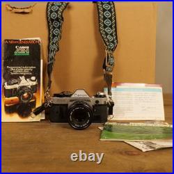 Canon AE-1 Program 35mm SLR Camera w 50mm 1.8 Lens Strap Manuals Vintage Works