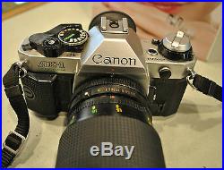 Canon AE-1 Program Camera +3 Lenses (1 Zoom) + Electronic Flash+ 6 Filters +Case