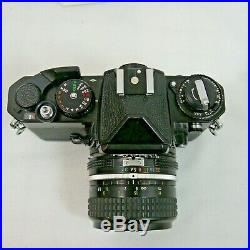 Nikon Fe 35 MM Slr Film Camera With 28 MM 13.5 Nikkor Lens And Extras