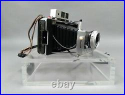 Polaroid Land Camera Model 180 with Tominon 114mm f4.5 Lens and Accessories