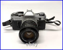VINTAGE Canon AE-1 35mm SLR Camera with 50mm 11.8 Lens VINTAGE Canon AE-1 35mm SLR Camera with 50mm 11.8 Lens