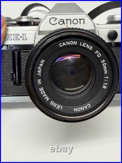 VINTAGE Canon AE-1 35mm SLR Camera with 50mm 11.8 Lens VINTAGE Canon AE-1 35mm SLR Camera with 50mm 11.8 Lens