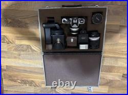 VINTAGE Nikon FE 35mm Film Camera with Multiple Lenses and Accessories VINTAGE Nikon FE 35mm Film Camera with Multiple Lenses and Accessories