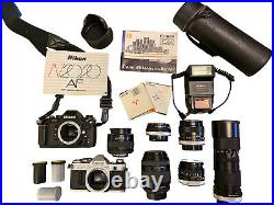 Vintage 35mm SLR Film Camera Lot Canon AE-1 Nikon N2020AF Lenses Flash Manuals