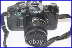 Vintage Black Body Canon AE-1 Program 35mm Film Camera with 50mm 11.4 Lens Tested