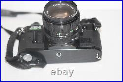 Vintage Black Body Canon AE-1 Program 35mm Film Camera with 50mm 11.4 Lens Tested