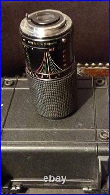 Vintage Camera Lens with Textured Barrel, Textured Grip, and Detailed Markings