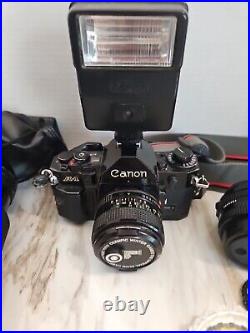 Vintage Canon A-1 Film Camera 35mm with3 Lenses Flash And Extras