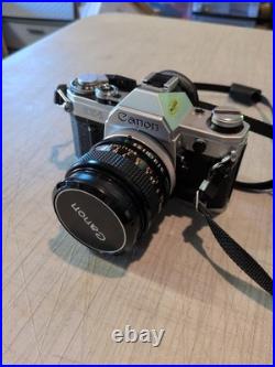 Vintage Canon AE-1 35mm Manual SLR Film Camera Bundle With 50mm Lens Strap & Case Vintage Canon AE-1 35mm Manual SLR Film Camera Bundle With 50mm Lens Strap & Case