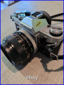 Vintage Canon AE-1 35mm Manual SLR Film Camera Bundle With 50mm Lens Strap & Case Vintage Canon AE-1 35mm Manual SLR Film Camera Bundle With 50mm Lens Strap & Case