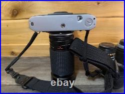 Vintage Canon AE-1 35mm SLR Film Camera with 35-200mm and 100mm FD Lens