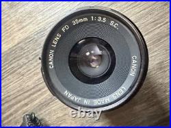 Vintage Canon AE-1 35mm SLR Film Camera with 35-200mm and 100mm FD Lens