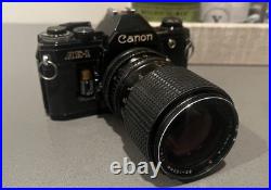 Vintage Canon AE-1 35mm SLR Manual Focus Camera All Black + RMC Tokina Lens