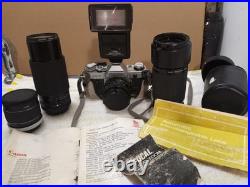Vintage Canon AE-1 Camera Lot With 3 Lenses Flashes Manuals & Carry Bag