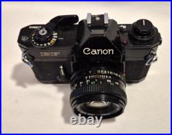 Vintage Canon EF black body 35mm SLR camera with 50mm 1.8 FD lens, extra body