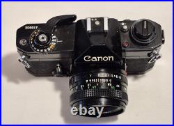 Vintage Canon EF black body 35mm SLR camera with 50mm 1.8 FD lens, extra body Vintage Canon EF black body 35mm SLR camera with 50mm 1.8 FD lens, extra body