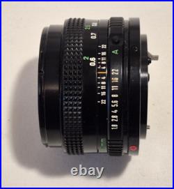 Vintage Canon EF black body 35mm SLR camera with 50mm 1.8 FD lens, extra body Vintage Canon EF black body 35mm SLR camera with 50mm 1.8 FD lens, extra body