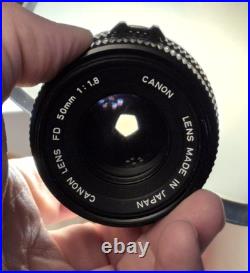 Vintage Canon EF black body 35mm SLR camera with 50mm 1.8 FD lens, extra body