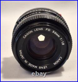 Vintage Canon EF black body 35mm SLR camera with 50mm 1.8 FD lens, extra body Vintage Canon EF black body 35mm SLR camera with 50mm 1.8 FD lens, extra body