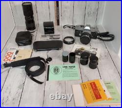 Vintage Canon FTb 35mm Camera with 50 mm lens & 85-205 mm lens plus extras
