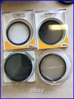 Vintage Lot Canon T50 35mm Camera With 2 Lenses 6 filters/flash/bag and more