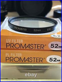 Vintage Lot Canon T50 35mm Camera With 2 Lenses 6 filters/flash/bag and more