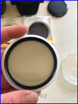 Vintage Lot Canon T50 35mm Camera With 2 Lenses 6 filters/flash/bag and more