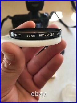 Vintage Lot Canon T50 35mm Camera With 2 Lenses 6 filters/flash/bag and more