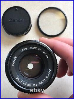 Vintage Lot Canon T50 35mm Camera With 2 Lenses 6 filters/flash/bag and more