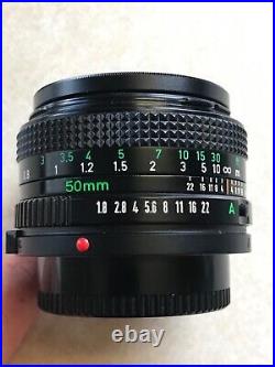 Vintage Lot Canon T50 35mm Camera With 2 Lenses 6 filters/flash/bag and more