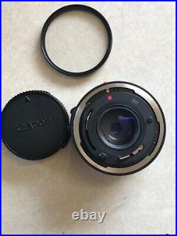 Vintage Lot Canon T50 35mm Camera With 2 Lenses 6 filters/flash/bag and more