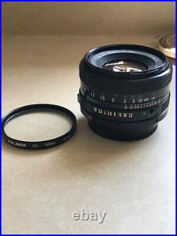 Vintage Lot Canon T50 35mm Camera With 2 Lenses 6 filters/flash/bag and more