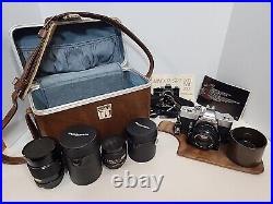 Vintage Minolta SRT 202 35MM CAMERA bundle with3 lenses, Leather case and manual