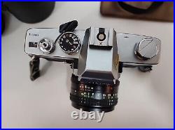 Vintage Minolta SRT 202 35MM CAMERA bundle with3 lenses, Leather case and manual