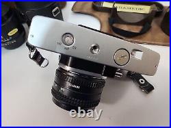 Vintage Minolta SRT 202 35MM CAMERA bundle with3 lenses, Leather case and manual