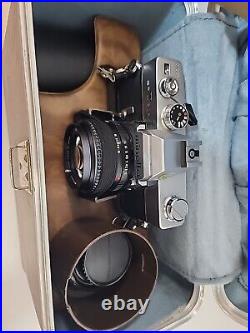 Vintage Minolta SRT 202 35MM CAMERA bundle with3 lenses, Leather case and manual