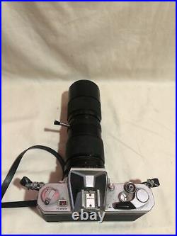 Vintage Nikkormat 35mm film camera with 85mm- 205mm lens