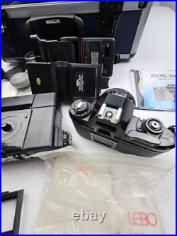 Vintage Nikon EM Film Camera With Hard Case And 16 Assorted Lens & Accessories