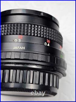 Vintage Nikon EM Film Camera With Hard Case And 16 Assorted Lens & Accessories