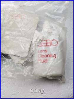 Vintage Nikon EM Film Camera With Hard Case And 16 Assorted Lens & Accessories