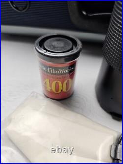 Vintage Nikon EM Film Camera With Hard Case And 16 Assorted Lens & Accessories