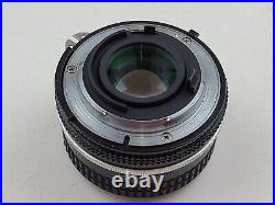 Vintage Nikon FM Chrome 35mm SLR Film Camera with Nikkor 50mm f/1.8 Lens + Manual