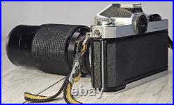 Vintage Nikon Nikkormat FT2 35mm SLR Film Camera with205mm Auto Zoom Lens TESTED