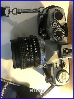 Vintage Olympus OM-1 Camera with Multiple lens, flash, winder and film