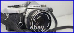 Vintage Olympus OM-1 film camera with 50mm 1.4 lens. Tested